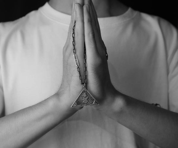 Close-up of hands in a meditative gesture, symbolizing mindfulness.